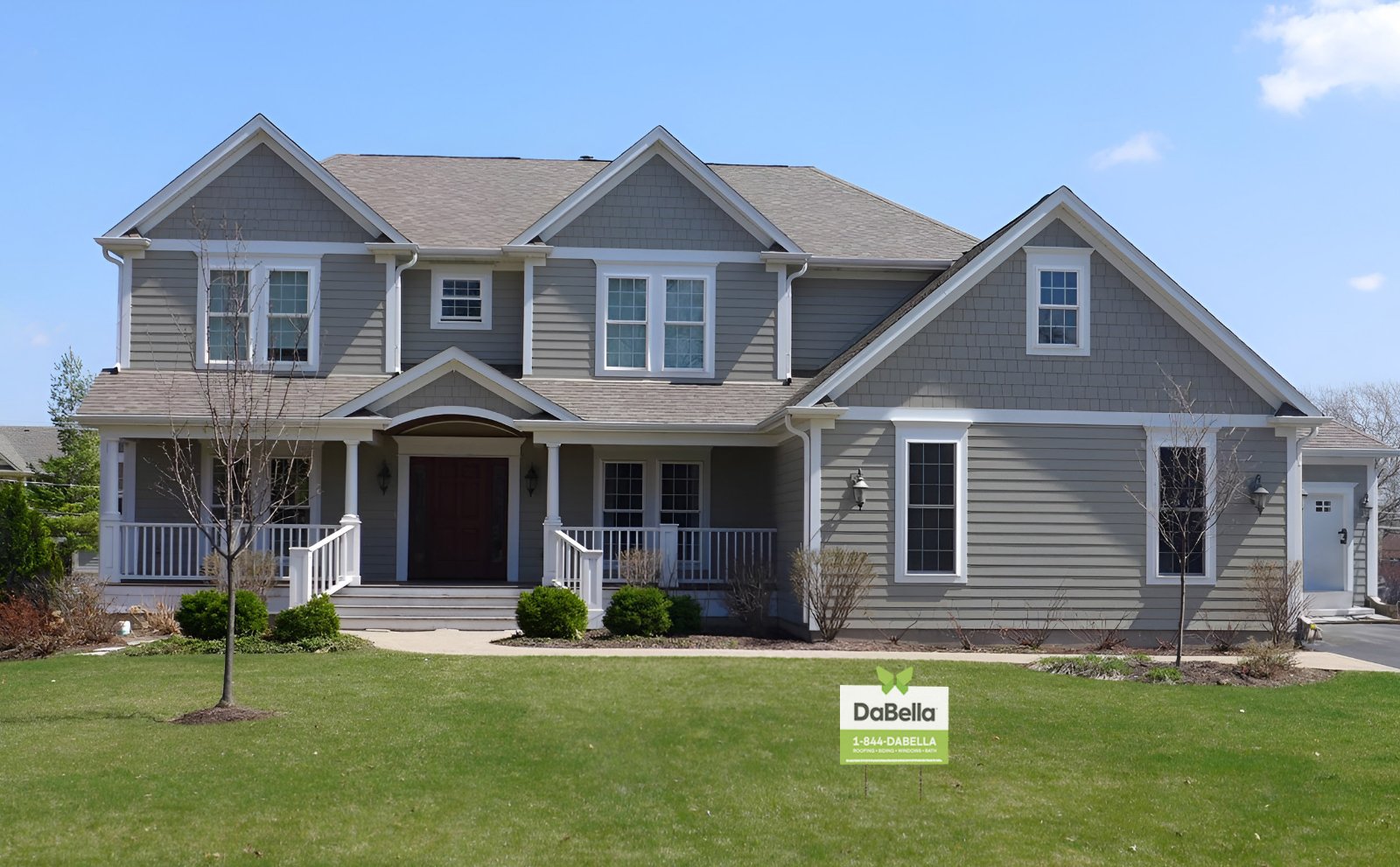 Siding Replacement done by DaBella in James Hardie Fiber Cement in the color Gray with white trim