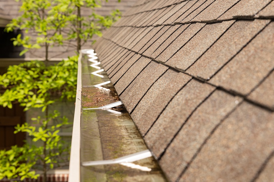 Clogged gutters caused by a clogged downspout